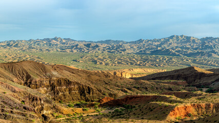 Ridgeline view of Red Canyon in Orocopia Mountains with Chocolate mountains gunnery range in the distance