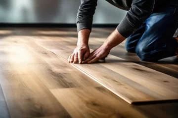 Deurstickers Hardwood Floor Renovation. Construction Worker Doing New floor © GalleryGlider
