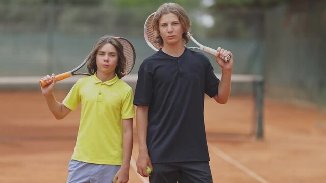 Portrait of two teenage tennis players