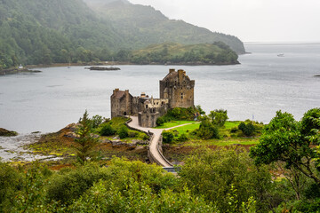 Early morning sunlight over Eilean Donan Castle at Kyle of Lochalsh in the Western Highlands of Scotland