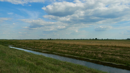 irrigation canal along the field. Reclamation channel for improving hydrological, soil and agro-climatic conditions in order to increase the efficiency of land and water resources use to crop yields