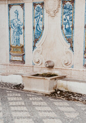 Beautiful stone fountain with azulejos and stone decorations, Portugal