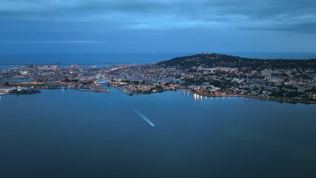 Drone's view: Nighttime Sète, coastal allure, maritime traditions, and vibrant culture.