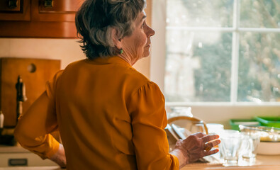 Grandmother is cleaning her house, is young at heart,