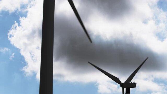 Installation silhouette of wind power turbines spinning