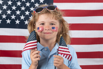 American little patriot. Independence day 4th of july. Child with american flag. American flag on kids cheek. USA flag concept.