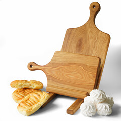 Fresh white marshmallows, bread and two homemade solid oak wooden cutting boards with round handles...