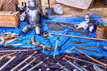 vast display of medieval weapons including swords, axes, and maces