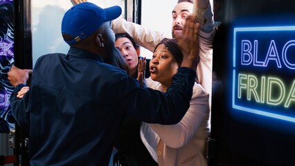 Diverse shoppers argue with security guard, waiting for black friday deals outside of department store. Crazy anxious clients being impatient in front of shopping center entrance.
