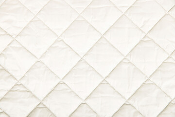 Quilted fabric background. texture blanket or puffer jacket - obrazy, fototapety, plakaty