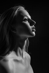 Dramatic black and white portrait of young blonde girl