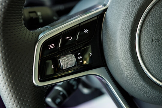 touch and mechanical control buttons for car assistants on the steering wheel