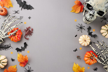 Reveling in the ghostly atmosphere that Halloween brings. Top view shot of skeleton hands, scary...