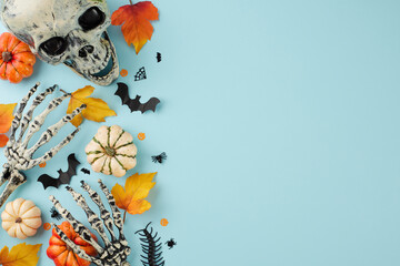 Partaking in the age-old rituals and customs of Halloween. Top view photo of skull, skeleton hands, colorful pumpkins, spooky insects, autumn leaves on light blue background with promo area