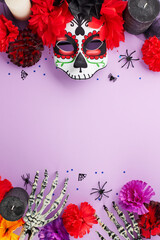 Immerse in the lively carnival atmosphere. Top view vertical photo of mask with elaborate decorations, flowers, skeleton hands, spooky decor, stars confetti on purple background with ad area