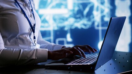 Admin writing artificial intelligence script code in cloud computing business establishment on laptop terminal. Tech savvy expert doing maintenance work in data center, upgrading AI systems