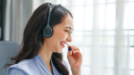 Asian business woman working with trade and finance partnership, investment bankers and institutional investors working closely on trade and finance deals. headphone, call center