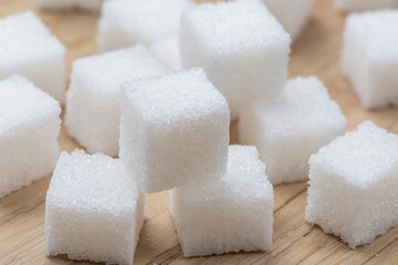 pieces of white refined sugar on the table