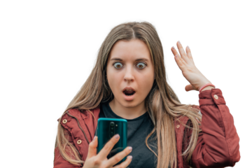 girl with surprised expression looking at the cell phone or mobile phone in the street