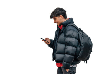 boy with mobile phone on the street in warm clothes