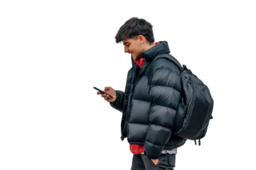 boy with mobile phone on the street in warm clothes