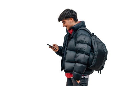 boy with mobile phone on the street in warm clothes
