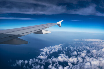 Fototapeta na wymiar Sky and cloud in a plane - holiday spirit in airplane
