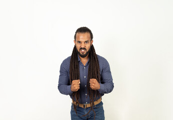 Angry Latino Man with Rasta Hair and Beard Staring at the Camera on White Background