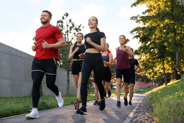 Obraz premium Group of people running outdoors. Active lifestyle