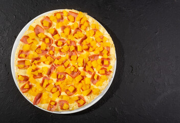 Delicious Hawaiian pizza with pineapple, ham and mozzarella