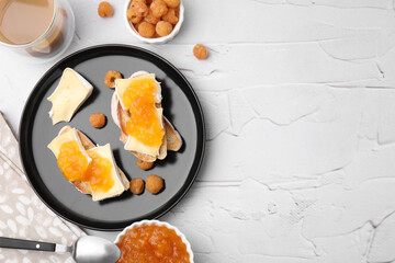 Tasty brie cheese sandwiches on white textured table, flat lay. Space for text