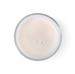 Glass of fresh milk isolated on white, top view