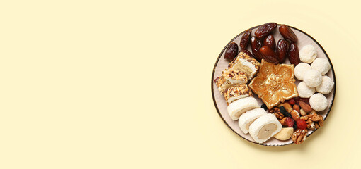 Plate with Indian treats on beige background with space for text. Divaly celebration