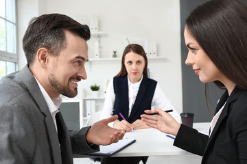 Human resources commission interviewing female applicant in office