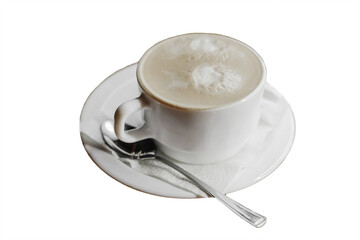 A cup of coffee with foam on a napkin with a spoon in a white saucer on a white isolated background