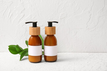 Bottles of shampoo on white background