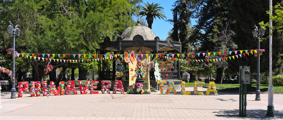 View of letters "Primavera Talca" (="spring Talca" in spanish) at the entrance of Plaza de Armas park in a small south american town (Talca, Chile)