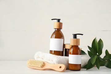 Set of spa supplies on white wooden background