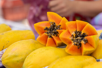 A ripe, juicy papaya cut in half.