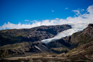 snowy mountains with cloudy sky in Iceland