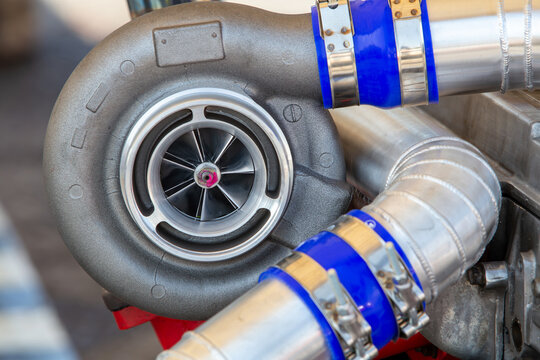 Car turbocharger on car engine,  Auto part turbo engine technology.