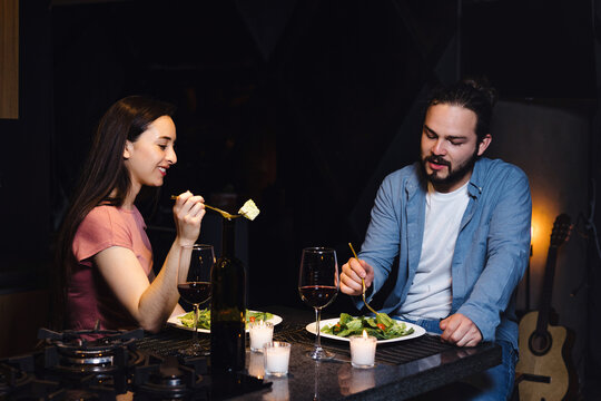 Young latin couple dining in date and celebration toasting at home in Mexico Latin America, hispanic people  in love