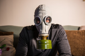 Civilian wearing nuclear gas mask during nuclear fallout and a time of war