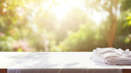 Fototapeta na wymiar White empty table background on blured laundry background