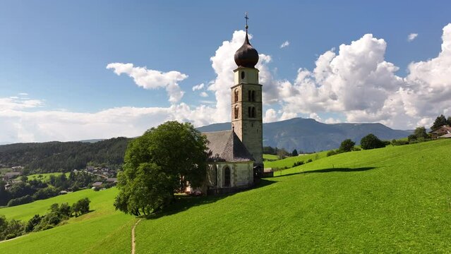 Amazing nature landscape in the Italian Alps. Wonderful summer view of St. Valentin Church on alpine meadow in Kastelruth. Location Dolomites, Alps, Bolzano, South Tyrol, Italy, Europe