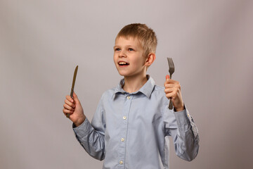 Child with fork and knife