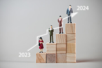 Miniature people:  A small businessman sitting on a pile of coins, Financial, Business Growth concept. 