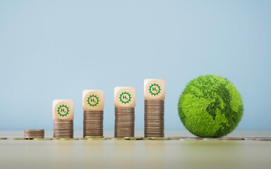 Investing in H2 hydrogen innovation, zero emissions On the coin with the green globe Help reduce carbon dioxide and greenhouse gases with clean hydrogen energy for a sustainable environment.