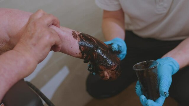 Therapeutic mud, wrapping, therapeutic mud wrapping procedure