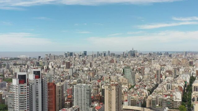 Aerial panoramic view of Buenos Aires, Argentina, drone slowly descending over Las Heras park.